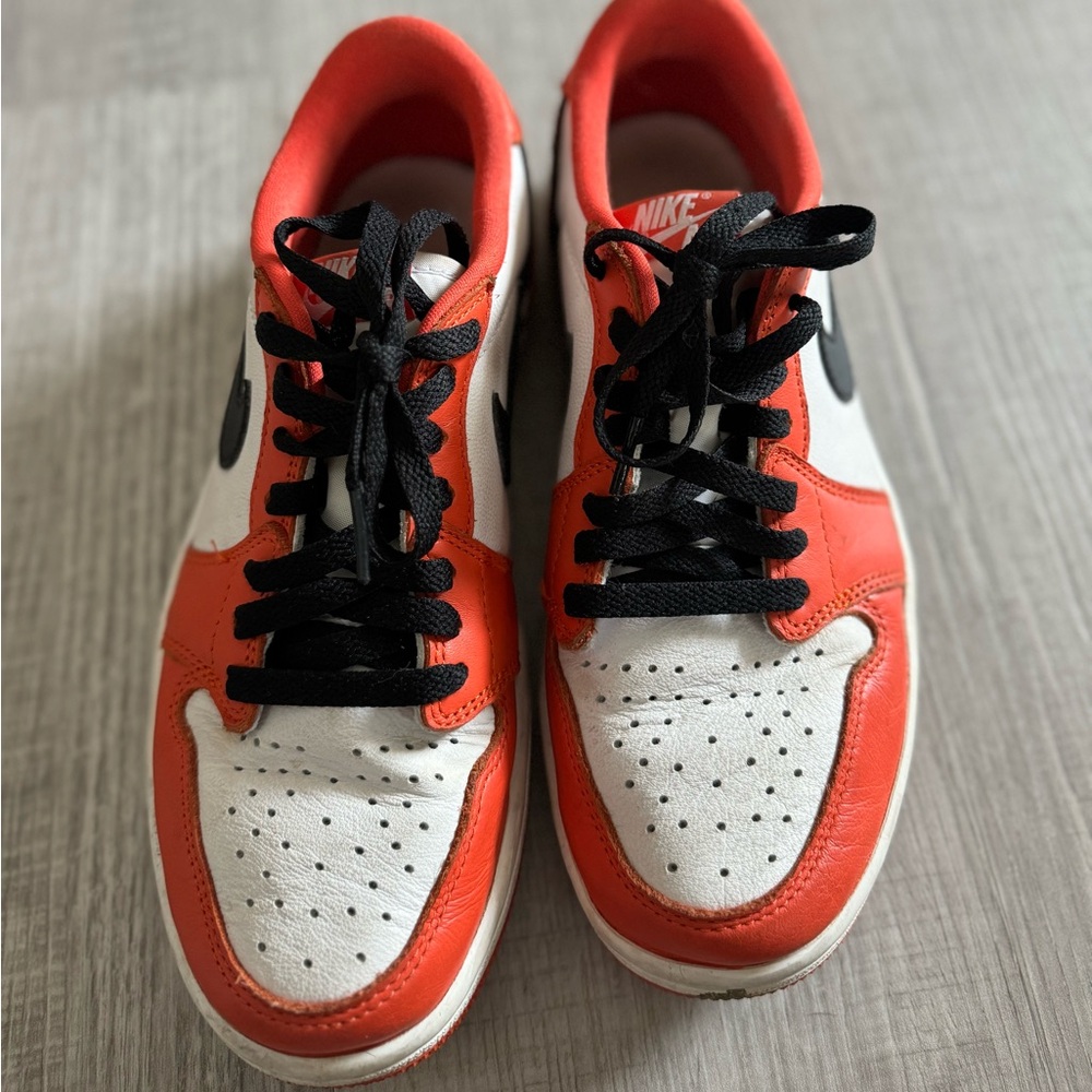 Orange black and white Nike Jordan Low men’s 7.5 fits woman 8.5